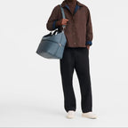 Lieblingstasche Le Pliage One travel bag in blue leather with silver hardware and double zip closure.