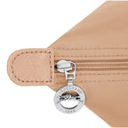 Lieblingstasche Le Pliage One handbag in beige nylon with leather trim and silver zipper pull with Longchamp logo.