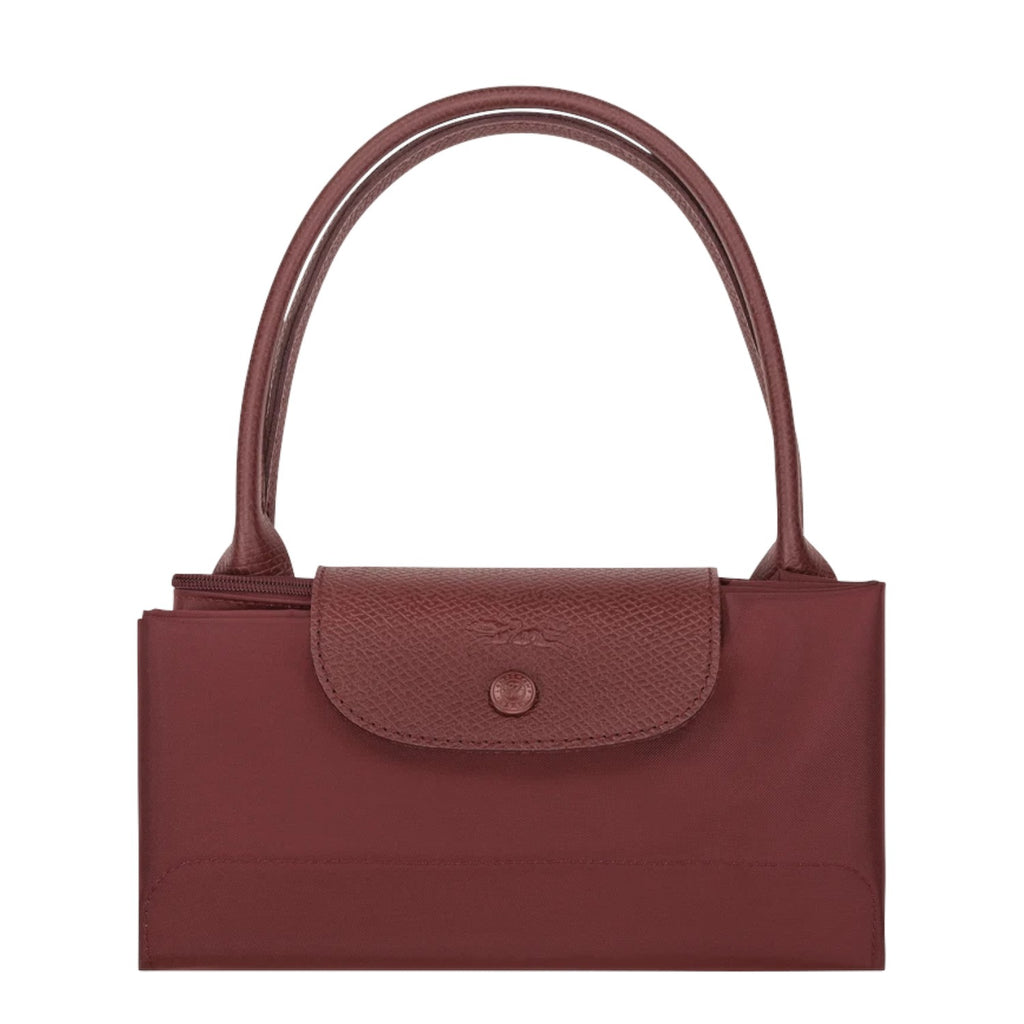 Lieblingstasche Le Pliage One handbag in burgundy nylon and leather with snap closure and top handles.