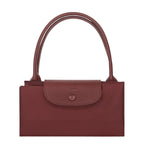 Lieblingstasche Le Pliage One handbag in burgundy nylon and leather with snap closure and top handles.