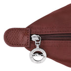 Lieblingstasche Le Pliage One handbag in burgundy nylon with leather trim and silver hardware.