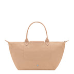 Lieblingstasche Le Pliage One Handtasche L, a beige nylon tote bag with leather handles and trim, featuring a front pocket and zip closure.