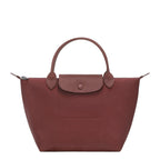 Lieblingstasche Le Pliage One Handtasche S, a small, reddish-brown leather handbag with a textured flap and button closure.