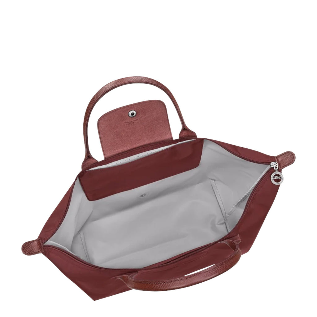 Lieblingstasche Le Pliage One L handbag in burgundy nylon with leather trim and handles. Features a snap-button flap closure and zip pocket.