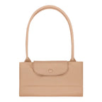 Lieblingstasche Le Pliage One L shoulder bag in beige leather with a single strap and button closure.