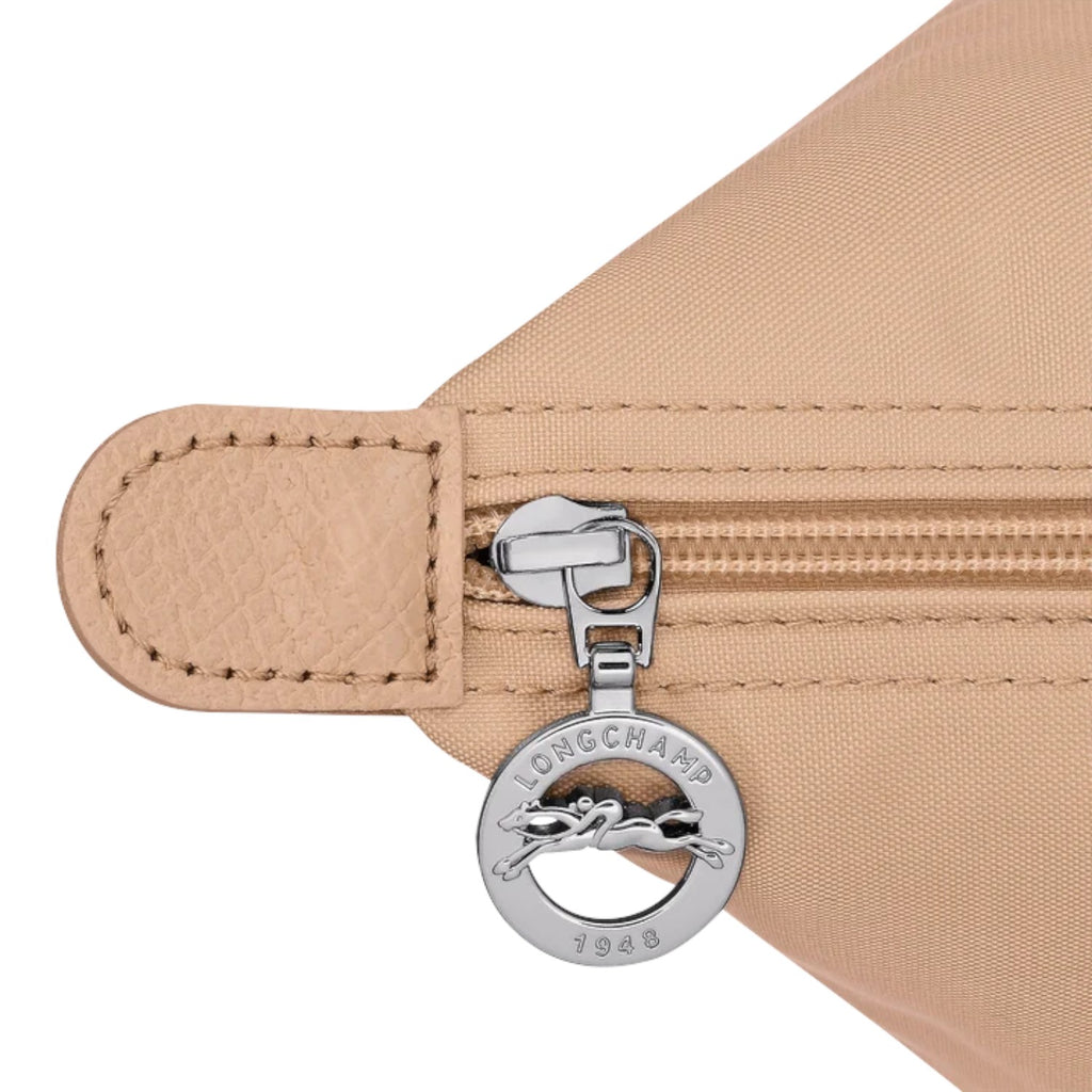 Lieblingstasche Le Pliage One L shoulder bag in beige nylon with leather trim and a silver zipper pull featuring the Longchamp logo.