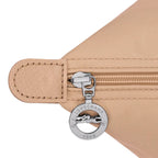 Lieblingstasche Le Pliage One L shoulder bag in beige nylon with leather trim and a silver zipper pull featuring the Longchamp logo.