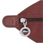 Lieblingstasche Le Pliage One L shoulder bag in burgundy nylon with leather trim and silver zipper charm.