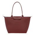 Lieblingstasche Le Pliage One L shoulder bag in dusty rose nylon with leather trim and snap closure.
