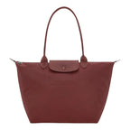 Lieblingstasche Le Pliage One L shoulder bag in dusty rose nylon with leather trim and snap closure.