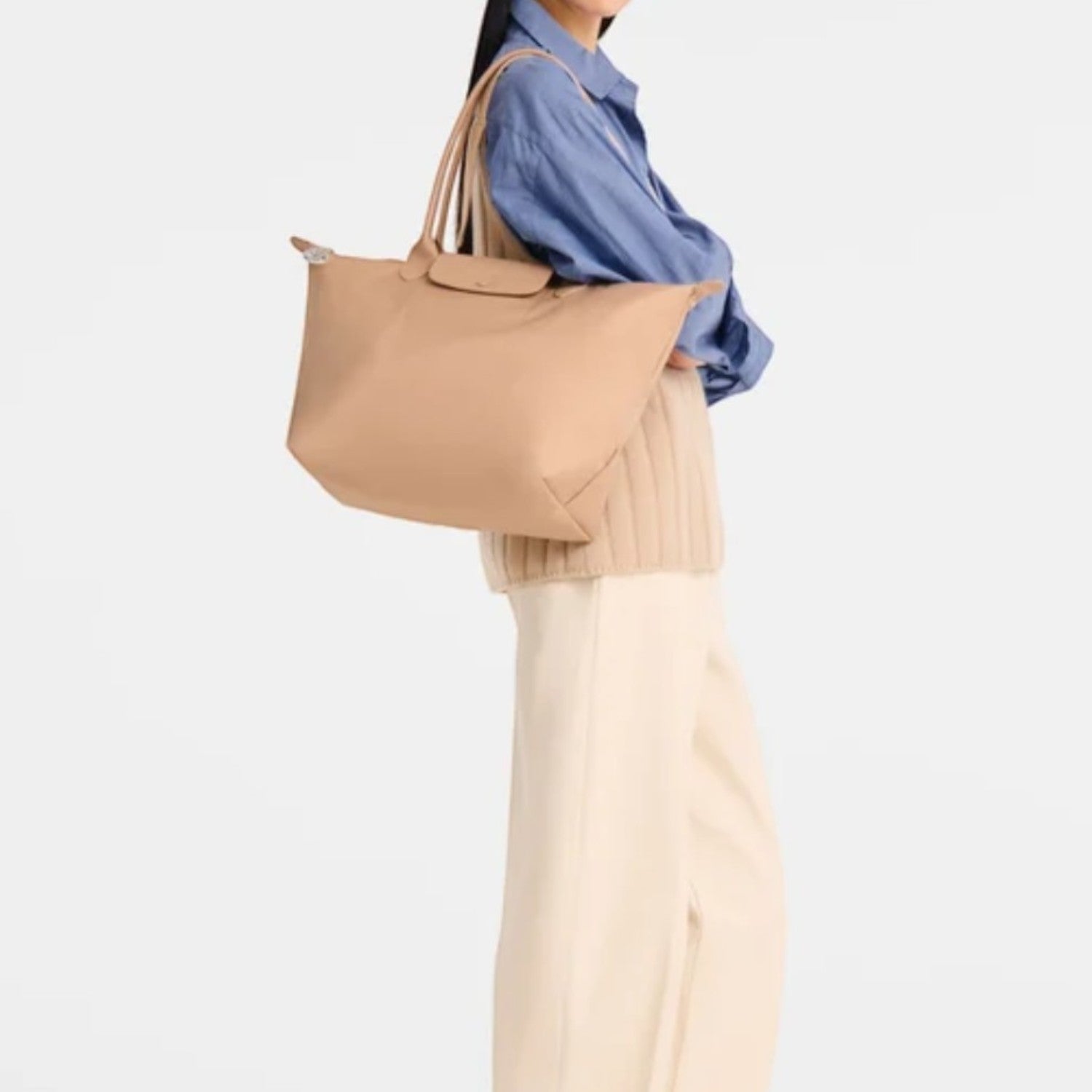 Lieblingstasche Le Pliage One L shoulder bag in tan leather with double handles and a zip closure.