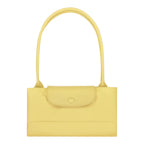 Lieblingstasche Le Pliage One L shoulder bag in pale yellow leather with a single top handle and a flap closure.