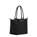Lieblingstasche Le Pliage One M black nylon shoulder bag with leather handles and snap closure.