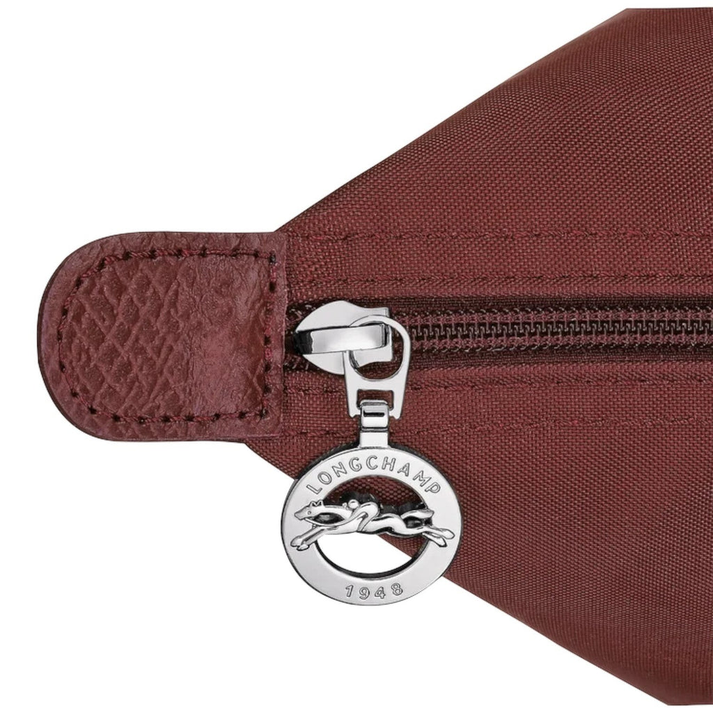 Lieblingstasche Le Pliage One M shoulder bag in burgundy nylon with leather trim and silver zipper detail.
