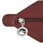 Lieblingstasche Le Pliage One M shoulder bag in burgundy nylon with leather trim and silver zipper detail.