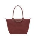 Lieblingstasche Le Pliage One M shoulder bag in red nylon with leather trim and snap closure.