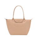 Lieblingstasche Le Pliage One M shoulder bag in beige leather with a snap button flap pocket and top handles.