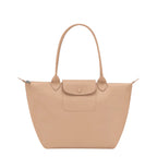 Lieblingstasche Le Pliage One M shoulder bag in beige leather with a snap button flap pocket and top handles.