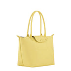 Lieblingstasche Le Pliage One M yellow leather tote bag with snap closure and top handles.