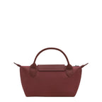 Lieblingstasche Le Pliage One Pochette in burgundy nylon with leather trim and handles.