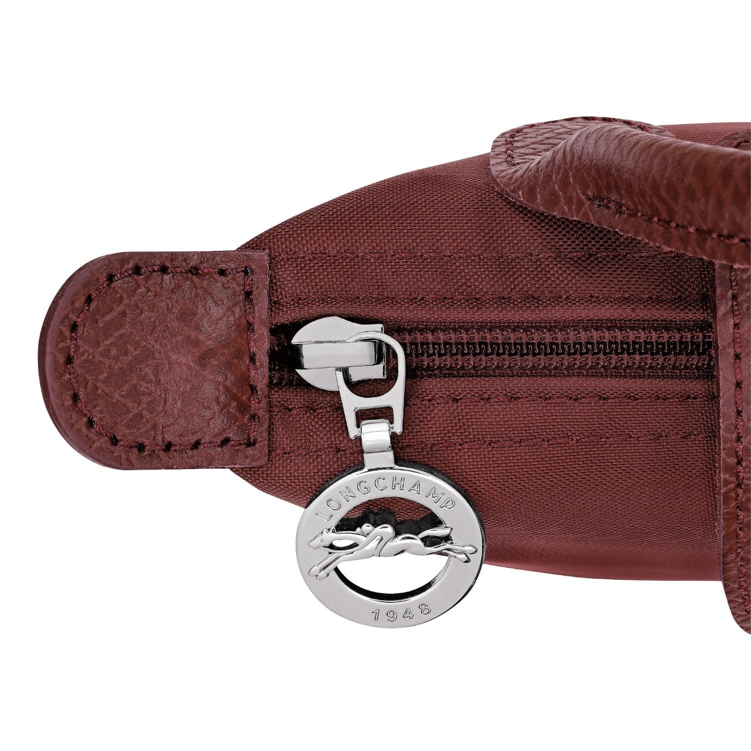 Lieblingstasche Le Pliage One Pochette in burgundy nylon with leather trim and silver zipper charm.
