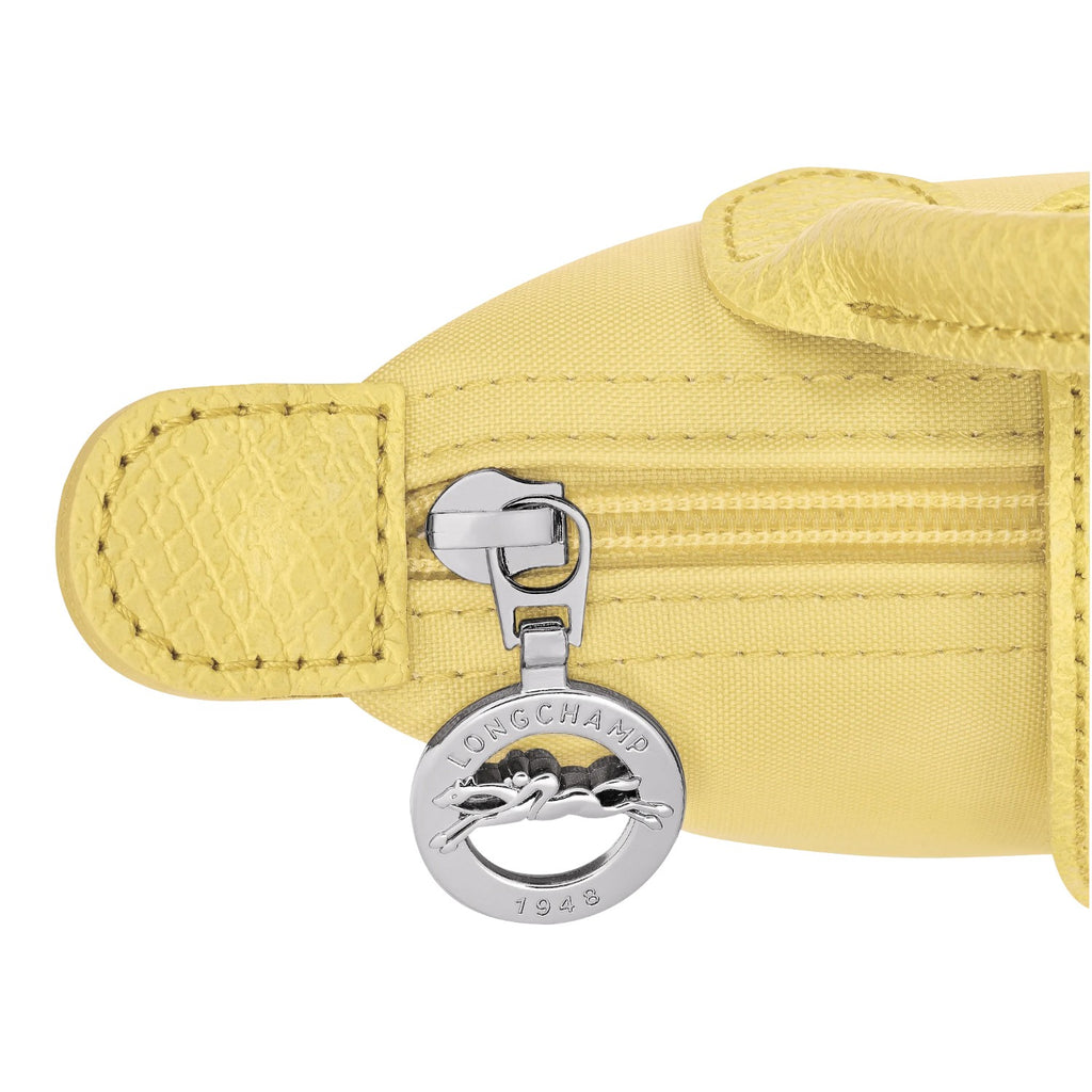 Lieblingstasche Le Pliage One Pochette in yellow nylon with leather trim and a silver horse logo zipper pull.