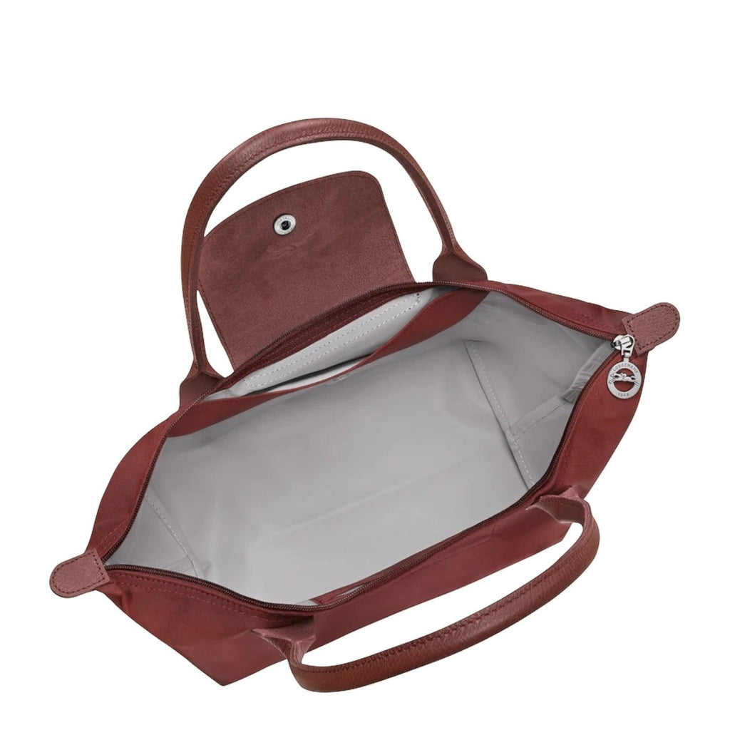 Lieblingstasche Le Pliage One shoulder bag in red nylon with leather handles and trim. Open top with zip closure.