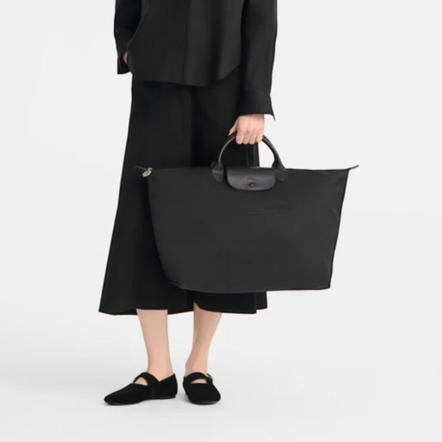 Lieblingstasche Le Pliage One Reisetasche L black nylon travel bag with leather handles and trim.