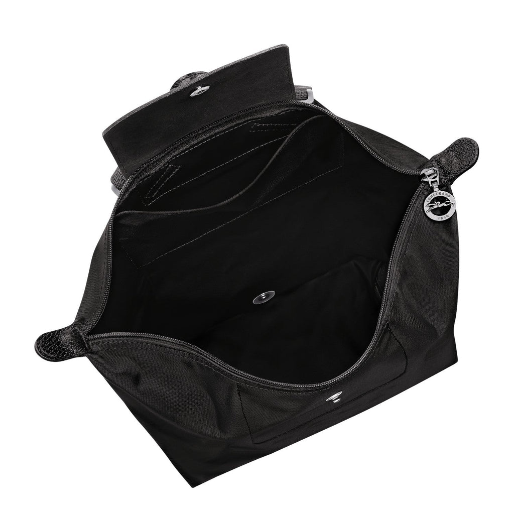 Lieblingstasche Le Pliage One Rucksack in black nylon with leather trim, featuring multiple interior pockets and a snap closure.