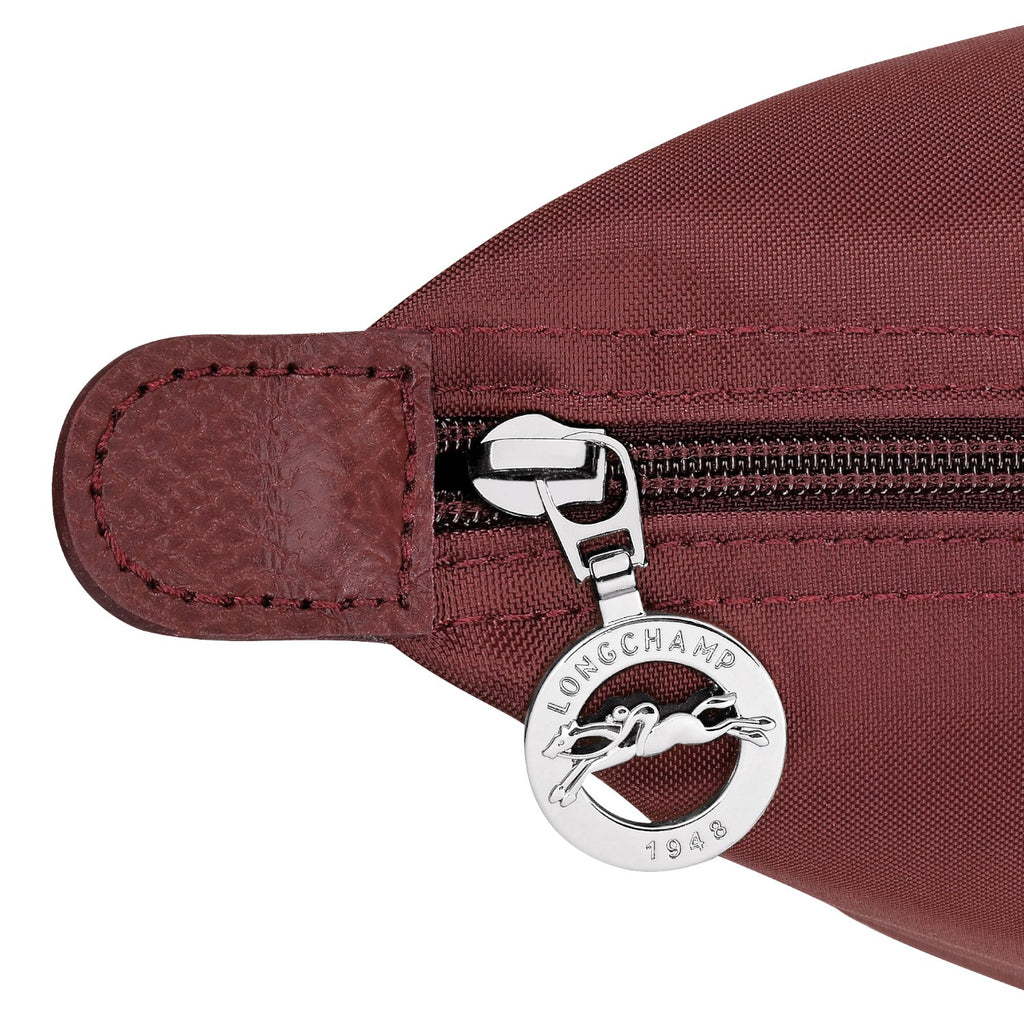 Lieblingstasche Le Pliage One Rucksack in burgundy nylon with leather trim and silver zipper pull featuring a horse logo.