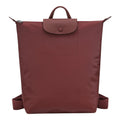 Lieblingstasche Le Pliage One Rucksack in deep red nylon with leather trim and flap closure.