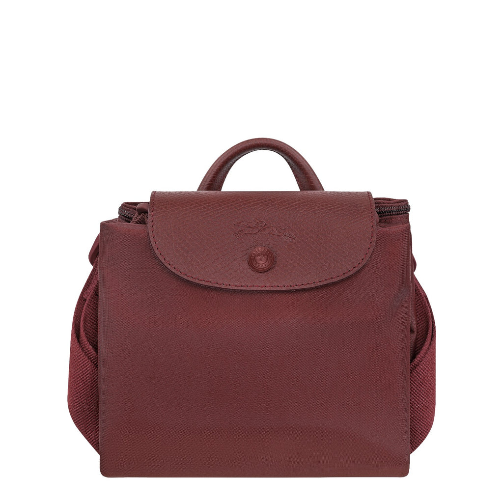 Lieblingstasche Le Pliage One Rucksack in deep red nylon with leather trim and a snap closure.