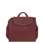 Lieblingstasche Le Pliage One Rucksack in deep red nylon with leather trim and a snap closure.