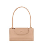 Lieblingstasche Le Pliage One shoulder bag in beige leather with a flap closure and single strap.