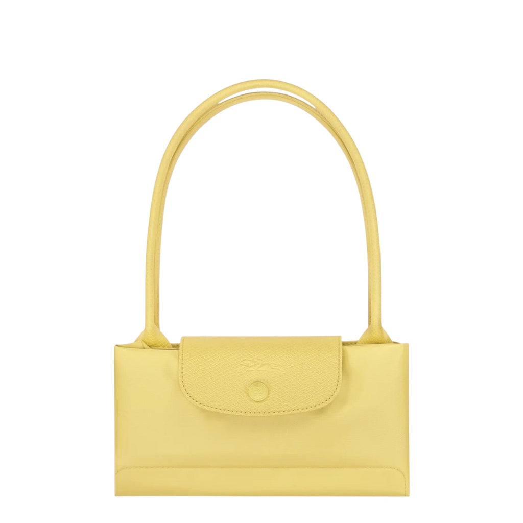 Lieblingstasche Le Pliage One shoulder bag in light yellow leather with a snap closure and top handles.