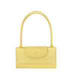 Lieblingstasche Le Pliage One shoulder bag in light yellow leather with a snap closure and top handles.