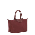 Lieblingstasche Le Pliage One tote bag in burgundy nylon with leather trim and handles. Features a snap closure flap pocket.