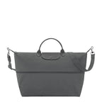Lieblingstasche Le Pliage One travel bag in dark grey nylon with leather trim and adjustable strap.