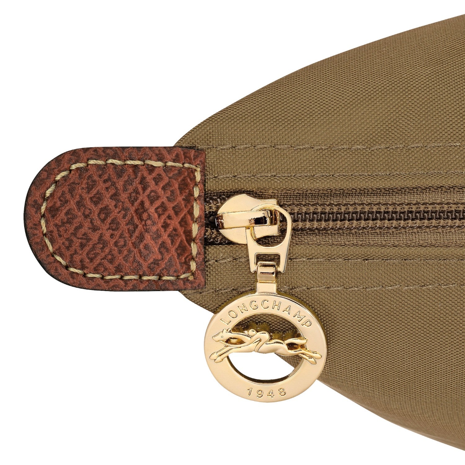 Lieblingstasche Le Pliage rucksack detail showing gold zipper pull with Longchamp logo and brown leather trim