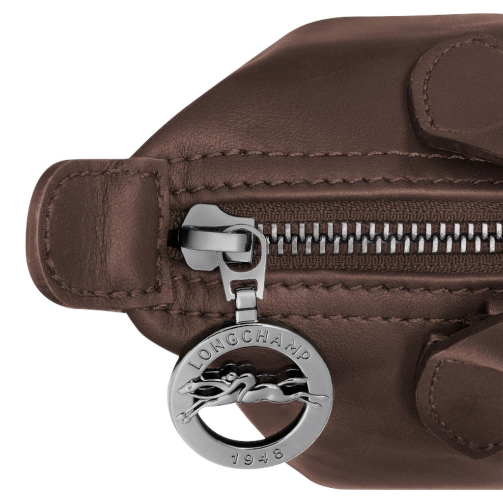 Lieblingstasche Le Pliage Xtra Handtasche XS, brown leather handbag with silver zipper and logo charm.