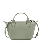 Lieblingstasche Le Pliage Xtra Handtasche XS, a small sage green leather handbag with top handles and a detachable shoulder strap.