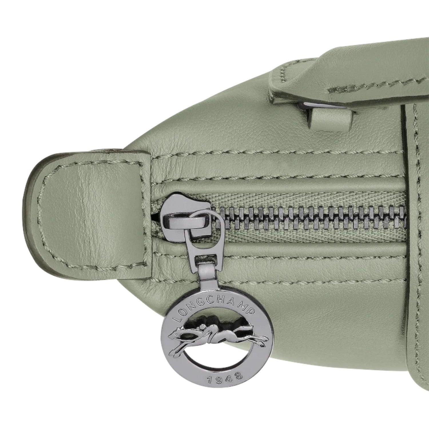 Lieblingstasche Le Pliage Xtra Pochette in light green leather with silver zipper and logo charm.