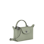 Lieblingstasche Le Pliage Xtra Pochette in light green leather with a top handle and crossbody strap.