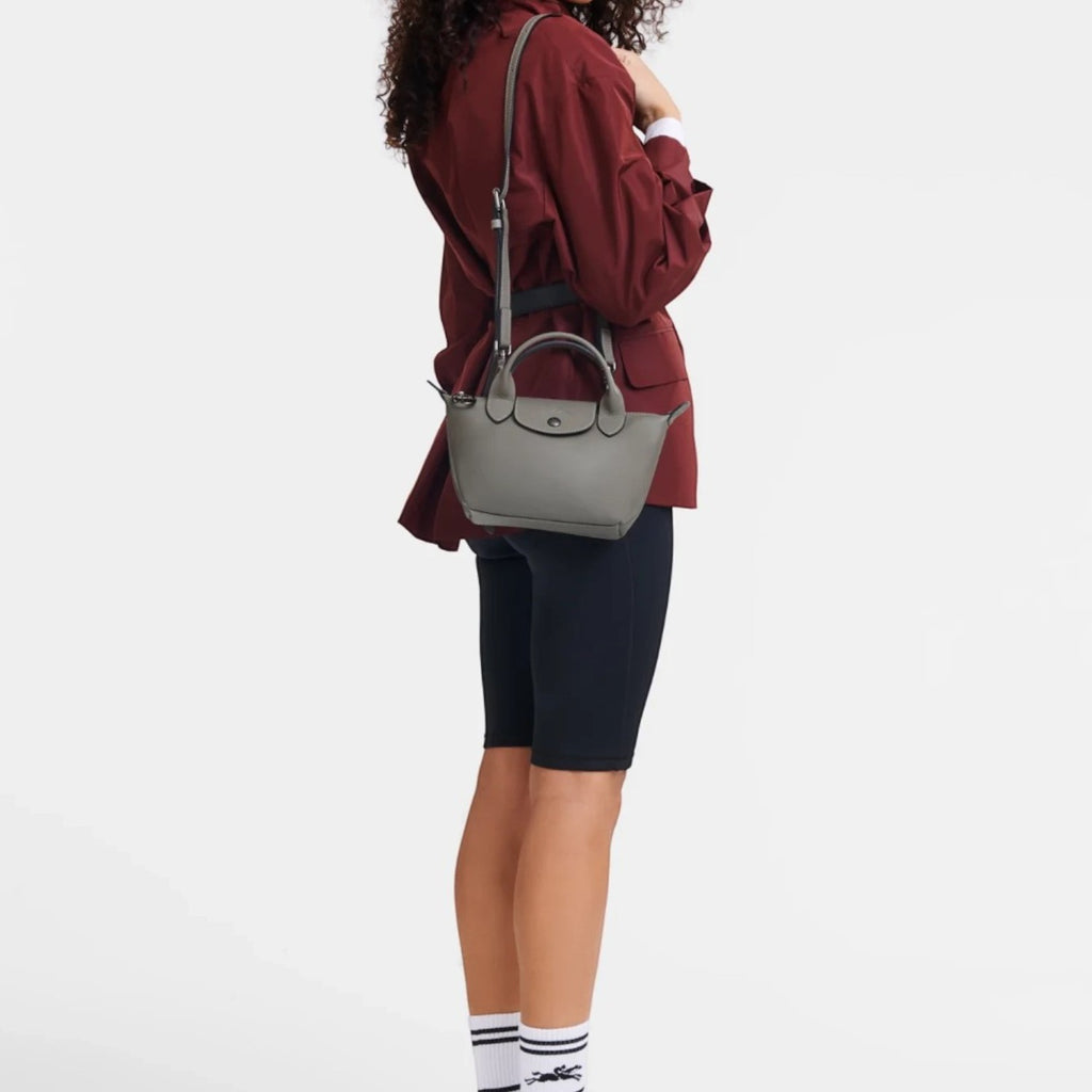 Lieblingstasche Le Pliage Xtra XS handbag in grey smooth cowhide leather worn on the shoulder by a model