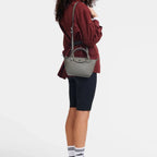 Lieblingstasche Le Pliage Xtra XS handbag in grey smooth cowhide leather worn on the shoulder by a model