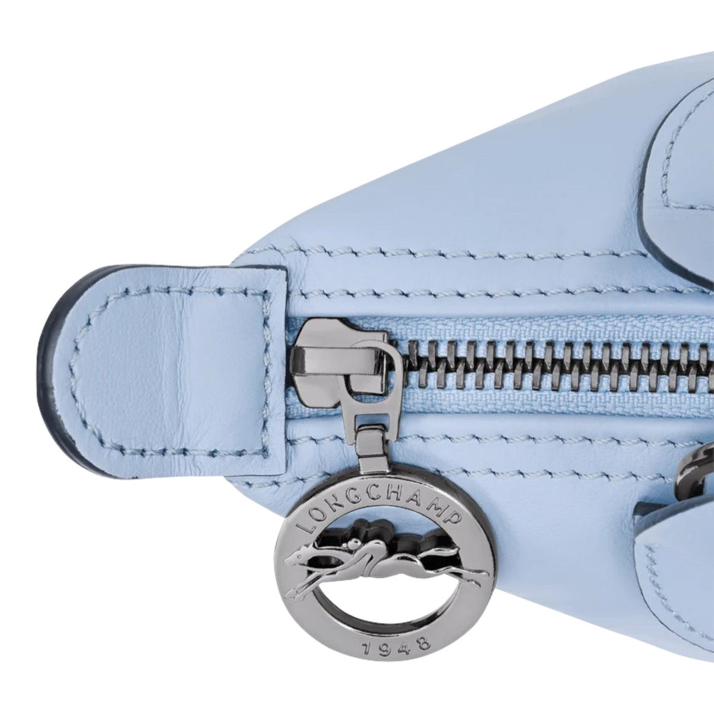 Lieblingstasche Le Pliage Xtra XS handbag in light blue leather with silver zipper and logo charm.