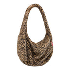 Lieblingstasche Moonbag in a soft leopard print faux fur with a slouchy crescent shape and single shoulder strap
