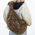 Lieblingstasche leopard print faux fur moonbag worn over the shoulder by a woman in a quilted jacket