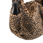Lieblingstasche Moonbag in leopard print faux fur with a black water bottle in the side pocket