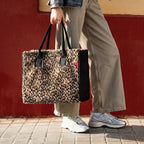 Lieblingstasche Daily Shopper tote bag in leopard print faux fur with black side panels held by a person outdoors